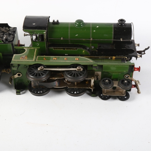 34 - HORNBY - a clockwork Hornby LMS O gauge locomotive, 2711, with tender, and a Hornby O gauge clockwor... 
