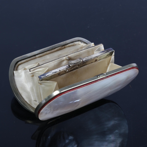 386 - An early 20th century lady's mother-of-pearl purse, with figural relief carved panel, L9cm