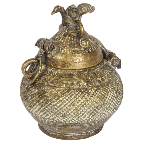 401 - An Indian brass Dhokra work money box, circa 1910, height 13cm