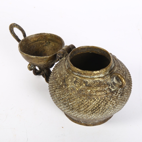 401 - An Indian brass Dhokra work money box, circa 1910, height 13cm