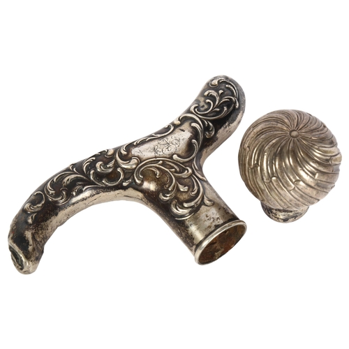 420 - A German 800 silver walking cane handle, and a Victorian silver fluted knop (2)