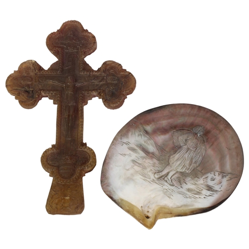 424 - A Russian pressed horn crucifix, height 19.5cm, and a 19th century French carved black lipped shell ... 