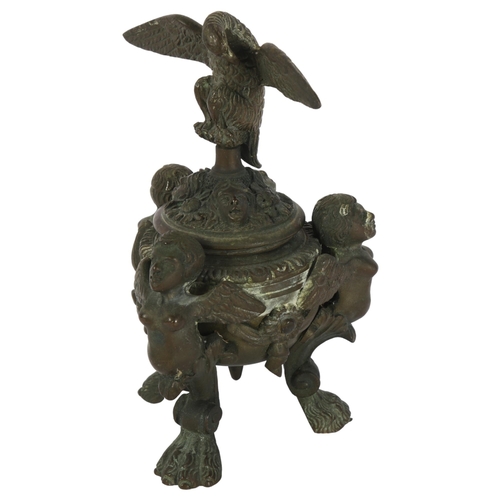 439 - A Napoleon III style patinated bronze inkwell, of Baroque design, with winged monopodia lion paw sup... 