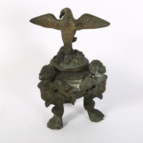 439 - A Napoleon III style patinated bronze inkwell, of Baroque design, with winged monopodia lion paw sup... 