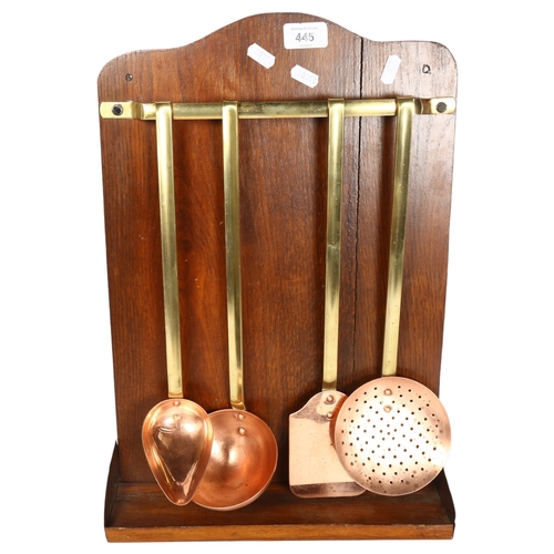 445 - A set of 4 French copper utensils, with associated oak backing board, board height 48cm, width 32cm