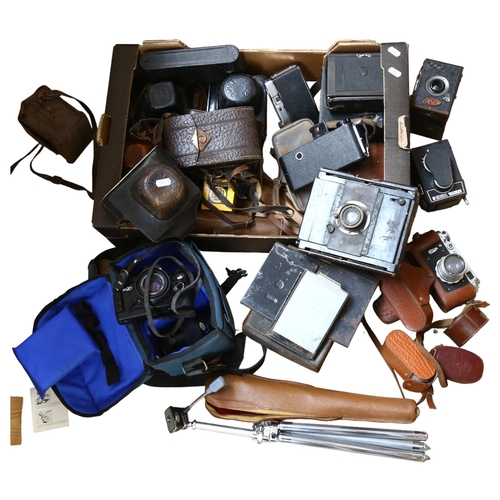 489 - A quantity of Vintage cameras, equipment and accessories, including a Praktica BX20, an Ensign all-d... 