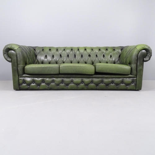 2191 - A green button-back leather upholstered three-seater Chesterfield sofa. Overall 205x69x88, seat 148x... 