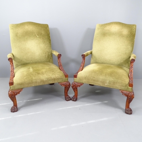 2196 - A pair of walnut and upholstered Gainsborough style open armchairs, on cabriole legs with carved dec... 