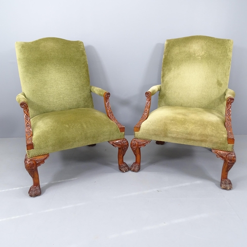 2197 - A pair of walnut and upholstered Gainsborough style open armchairs, on cabriole legs with carved dec... 