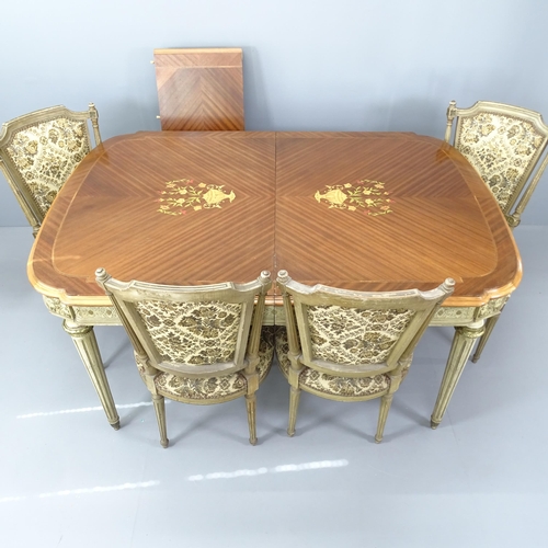 2198 - An ornate French walnut and kingwood dining table, with inlaid floral decoration on carved and paint... 