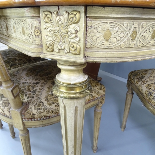 2198 - An ornate French walnut and kingwood dining table, with inlaid floral decoration on carved and paint... 