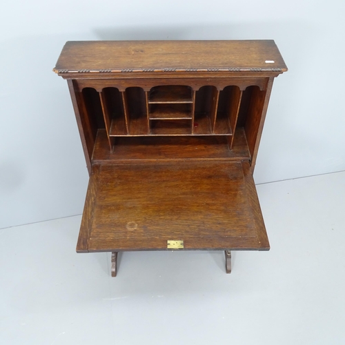 2199 - An early 20th century oak student's bureau. 67x112x30cm