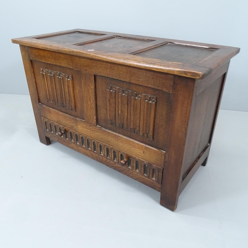 2203 - A modern panelled oak blanket box with carved linenfold decoration. 96x61x45cm.