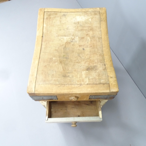 2204 - An antique pine topped butcher's block, on painted base with single frieze drawer. Initialled S K to... 