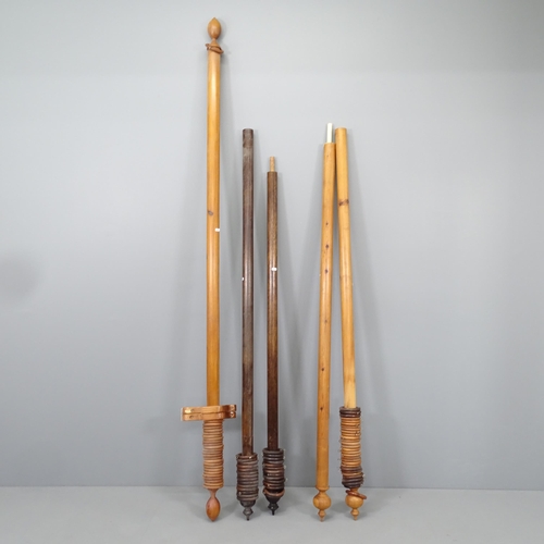 2206 - Two pine curtain poles, and an oak curtain pole, with rings and brackets. Lengths (from left to righ... 