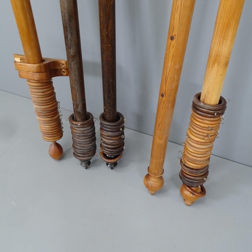 2206 - Two pine curtain poles, and an oak curtain pole, with rings and brackets. Lengths (from left to righ... 