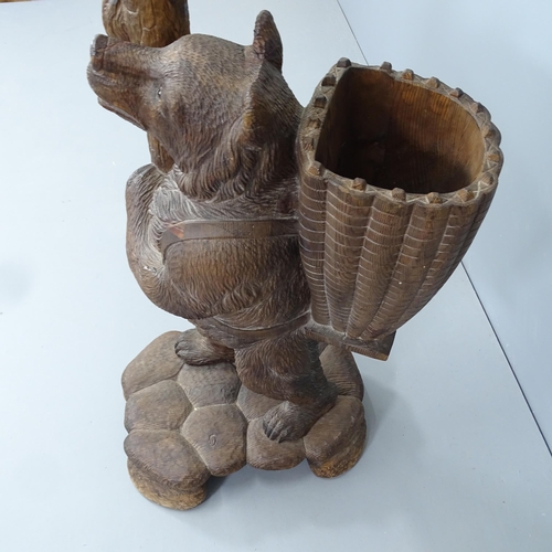 2207 - A large and impressive Black Forest hall stand in the form of a bear holding a branch, with hand pai... 