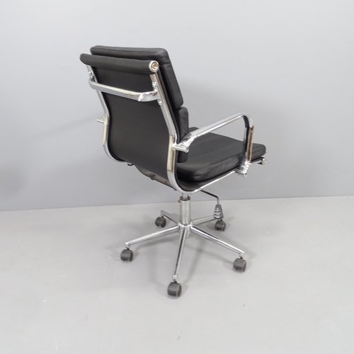 2214 - A contemporary leather upholstered swivel office chair on chrome base.