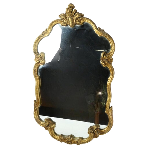 365 - A shield-shape gilt-framed wall mirror, length 78cm