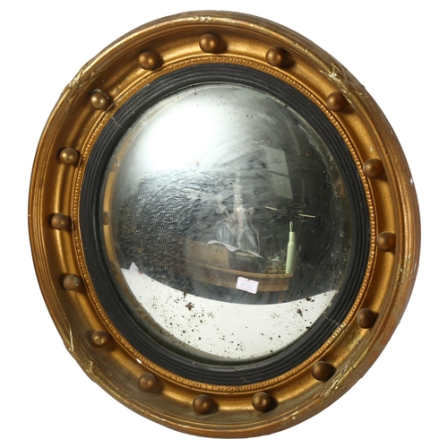 366 - A Victorian giltwood and gesso convex wall mirror, with ball decoration, diameter 43cm