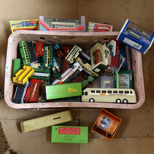54 - A large quantity of boxed and unboxed diecast vehicles, mostly bus-related in nature, including many... 