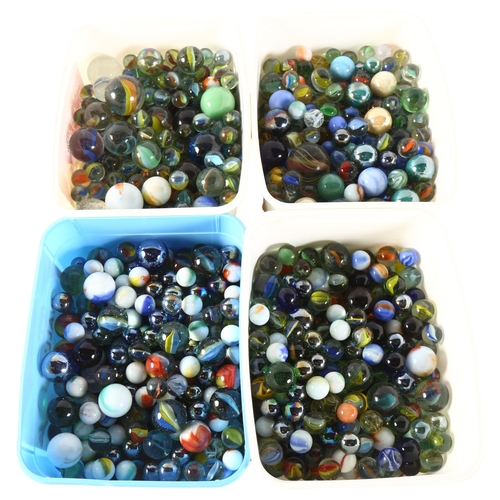 93 - A large quantity of Vintage marbles, 4 small plastic boxfuls