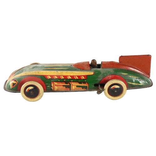 96 - A vintage Wells Brimtoy tinplate clockwork racing car, length 29cm.