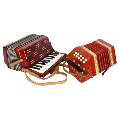 495 - SCHOLER - a 1940s model no. 502 floral German concertina accordion, and a mini piano accordion, with... 