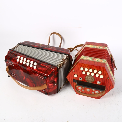 495 - SCHOLER - a 1940s model no. 502 floral German concertina accordion, and a mini piano accordion, with... 