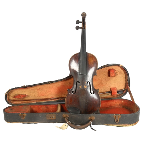 528 - A Victorian violin, with carved lionhead scroll, and horsehair bow, in hardshell case, violin is in ... 