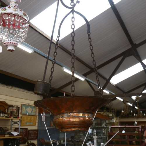 558 - A 19th century copper boiling pot, with crane style bracket and lead counter-balance, drop from brac... 