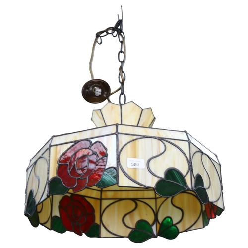 560 - A Tiffany style lead and coloured glass ceiling light shade, with red rose decoration, diameter 44cm