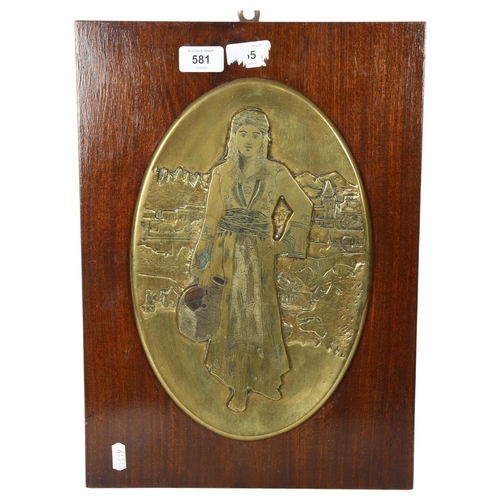 581 - J. Kazazian?, an embossed oval bronze plaque, study of a Middle Eastern water carrier, mounted on te... 