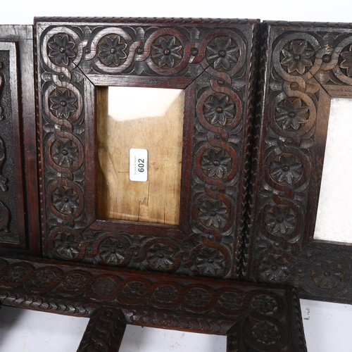 602 - A set of 3 carved oak frames, with scrolled circle and floral decorated borders, and another carved ... 