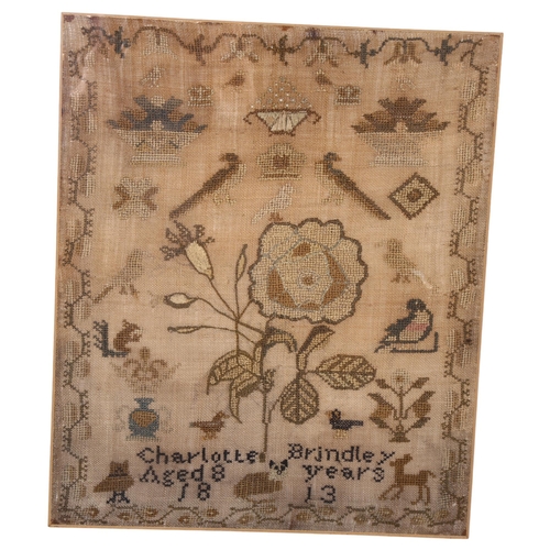 609 - A Regency Period cross-stitch sampler by Charlotte Brindley aged 8 years, 1813, with design of flowe... 