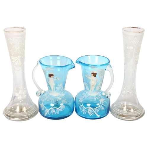 617 - A pair of turquoise Mary Gregory design glass jugs, 12cm, and a pair of vases with floral decoration