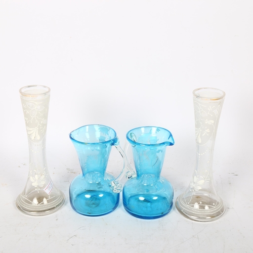 617 - A pair of turquoise Mary Gregory design glass jugs, 12cm, and a pair of vases with floral decoration