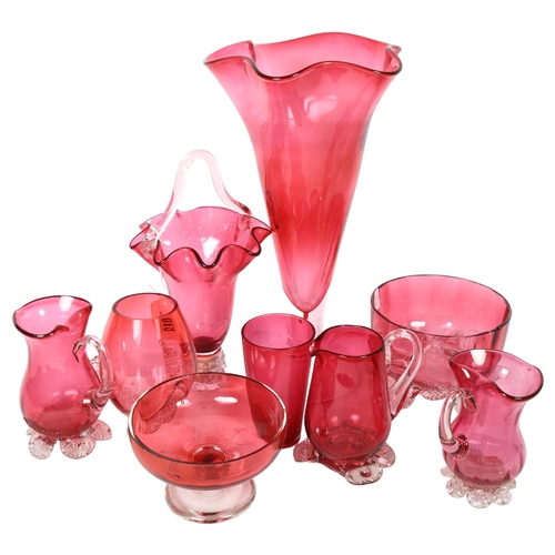 619 - A group of cranberry glass jugs and vases, tallest 29cm