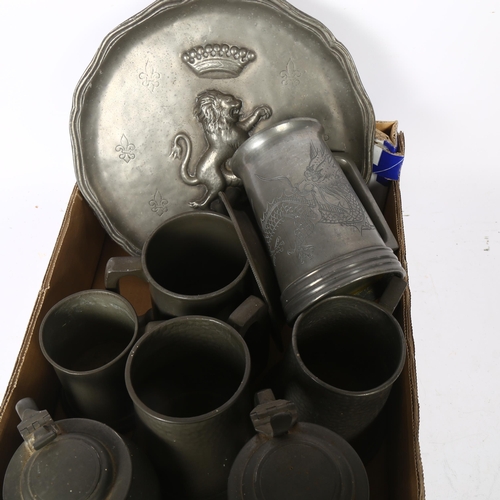 634 - Various pint pewter mugs, a pewter tray with embossed lion etc