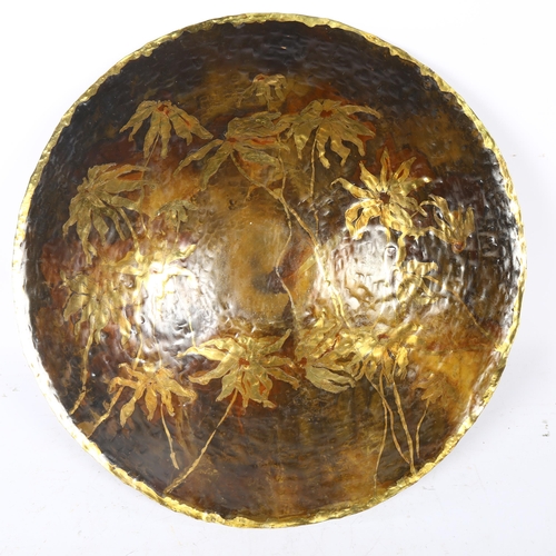 636 - Planished brass dish with floral decoration, 57cm