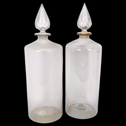 638 - A pair of large Antique glass Chemist's bottles and stoppers, height 50cm