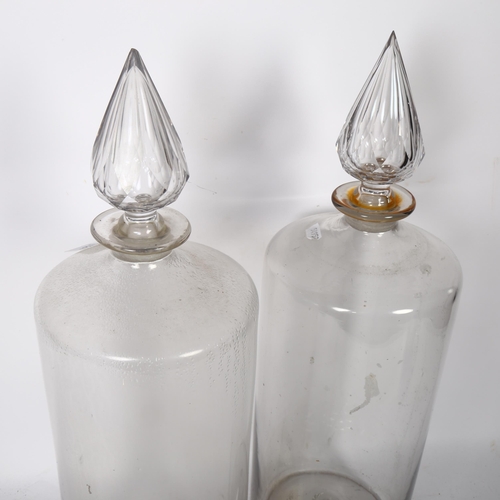 638 - A pair of large Antique glass Chemist's bottles and stoppers, height 50cm