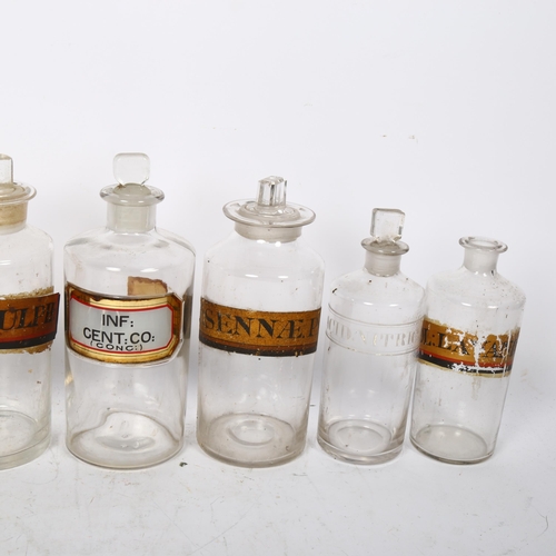 639 - A group of 8 Antique Chemist's bottles with 7 stoppers, 1 with etched Acid.Nitric.D label, the other... 