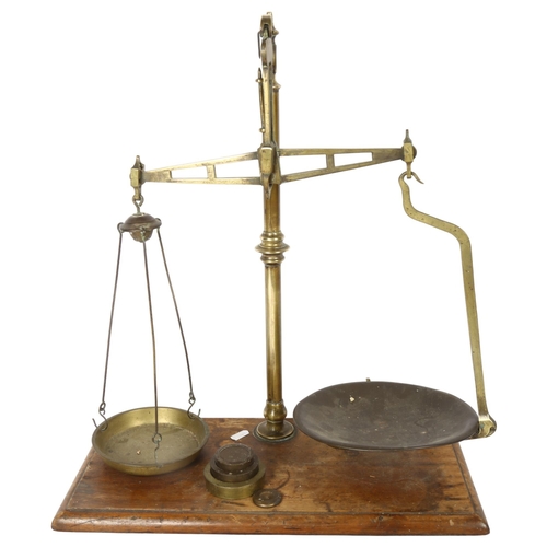 655 - Antique brass balance scale on plinth, height 51cm