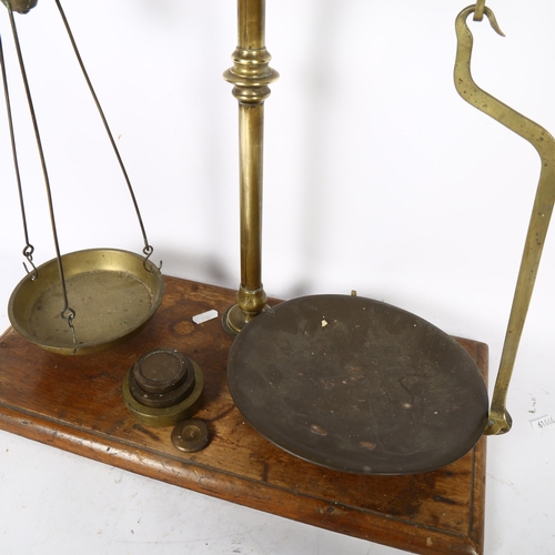 655 - Antique brass balance scale on plinth, height 51cm