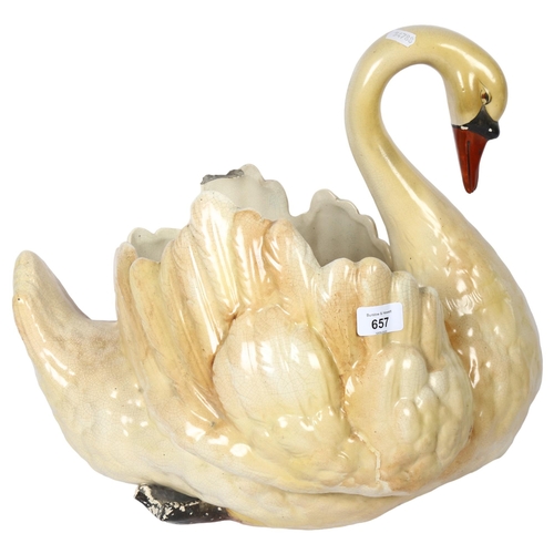 657 - A large pottery swan figure vase (A/F), height 40cm