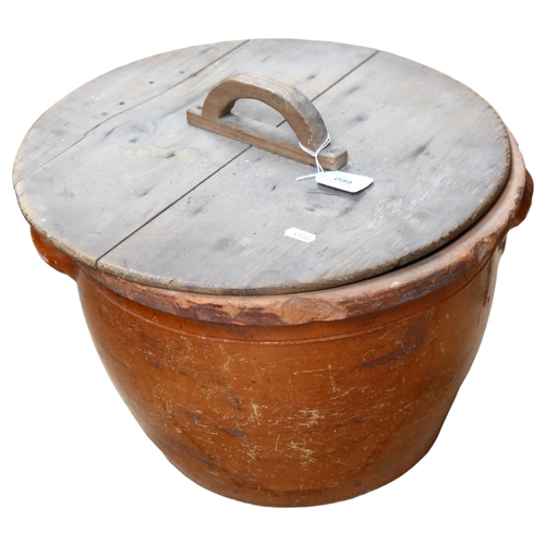 660 - Antique glazed ceramic bread crock, with wooden cover, diameter 40cm