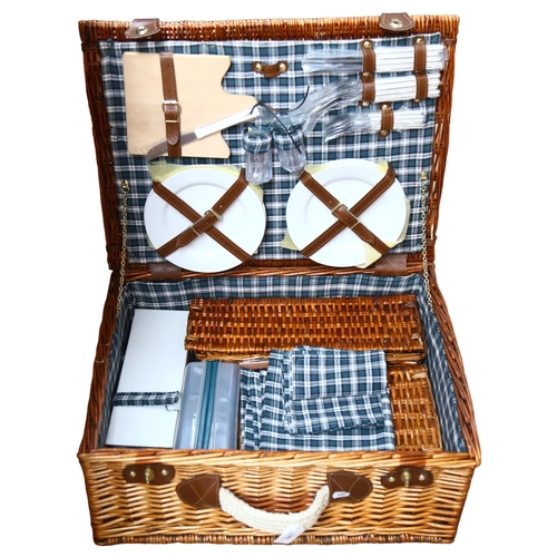 661 - A wicker cased picnic set, as new