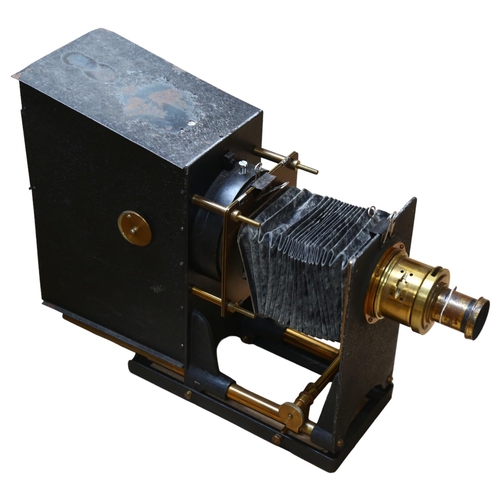 673 - A Victorian painted and brass-mounted magic lantern, with bellow slide, H34cm, base L30cm