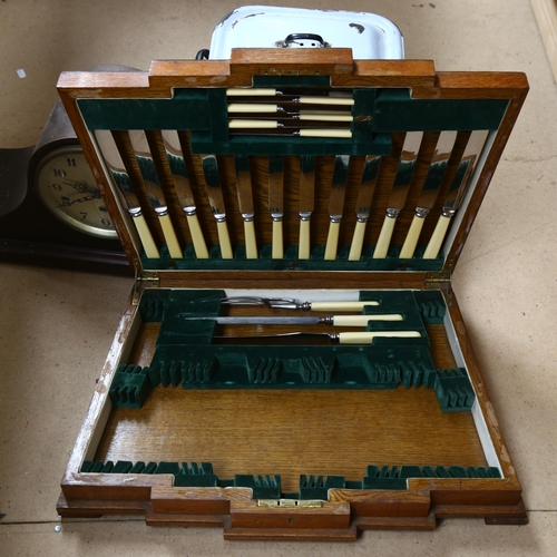 678 - A Napoleon hat clock (glass cracked), an Art Deco oak canteen box and contents, and an enamel bread ... 